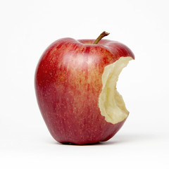 Red apple with a bite out of it, isolated on a white background - 313270884