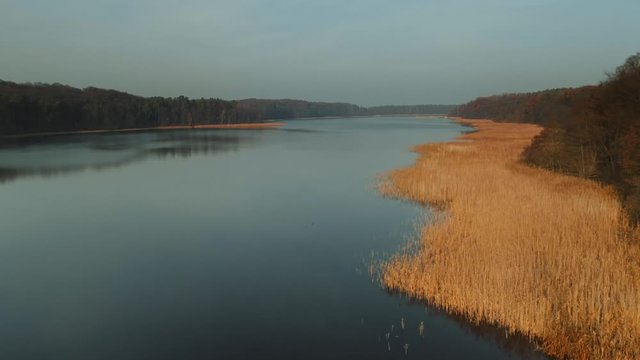 Polish longest lake at Masuria, Jeziorak at sunset. Drone, aerial footage.