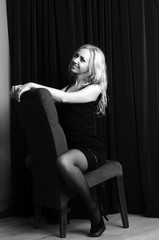 Fashion photo of young lady in elegant black dress