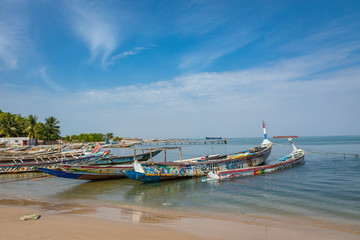 Fototapeta na wymiar Traditional painted wooden fishing boat in Djiffer, Senegal. West Africa.