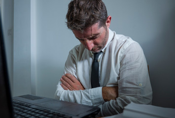 corporate business work stress - young desperate and frustrated businessman working stressed and...