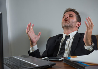corporate business company worker in stress - attractive sad and depressed businessman working...