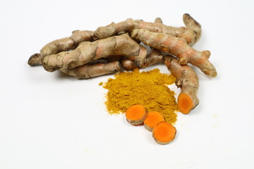 Turmeric powder and fresh turmeric extracted on a white background are used as body tonic. Skin care products and gardening ingredients in food