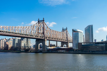 Fototapeta na wymiar Queensboro Bridge along the East River with the Roosevelt Island Skyline in New York City