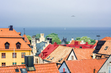 Sail over old tile Roofs of Visby. Gotland. Sweden