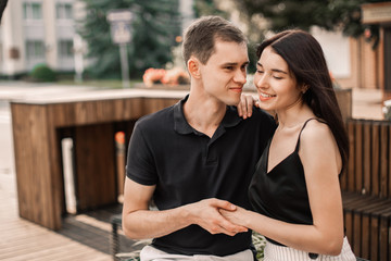 Loving couple hugging in the street.