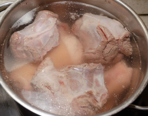 Fototapeta premium The meat is cooked in a pan. Beef, pork, spices. Jellied meat. National Russian cuisine.