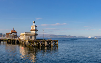 derelict peir with boats sailing away