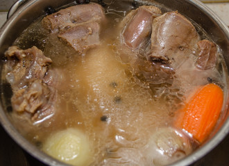 The meat is cooked in a pan. Beef, pork, spices. Jellied meat. National Russian cuisine.