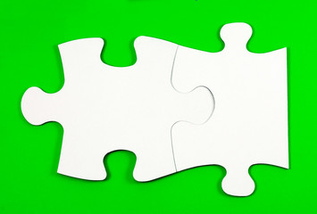 .connected puzzles on a green background