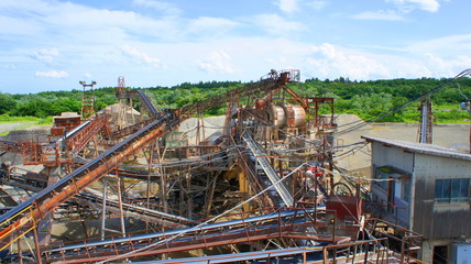 Fototapeta na wymiar Big equipment of crushed stone factory