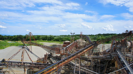 Fototapeta na wymiar Big equipment of crushed stone factory
