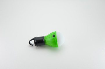 LED lamp in the form of a lamp with a hook. Black-white-green.