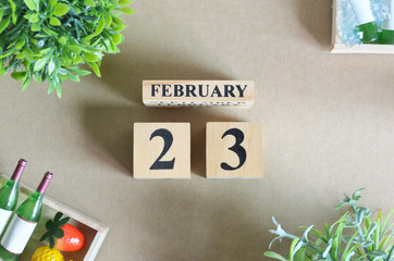 February 23, Empty Background, Design with number cube strawberry pine apple and wine in natural concept.	