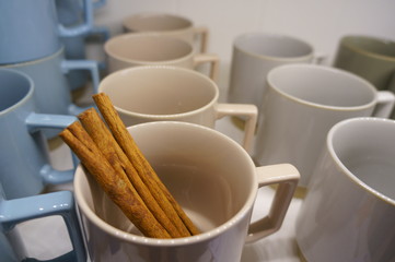 Coffee cup and cinnamon stick