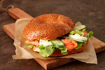 Bagel with salmon and salad