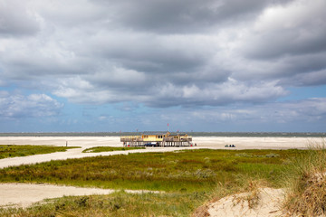 Beach pavilion on the beach of Schiermonnikoog on the North Sea seen from the dunes