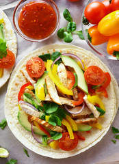 Taco with chicken meat and vegetables
