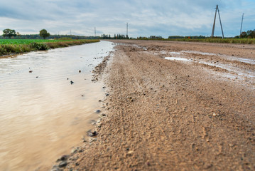 Road with big puddle.