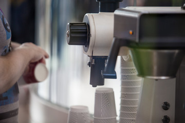Fototapeta na wymiar The process of making coffee in a coffee machine