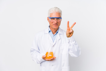 Mature chemical man isolated showing number two with fingers.