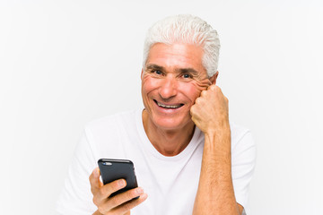 Mature caucasian man talking on phone