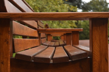 Side View of a Row of Brown Benches