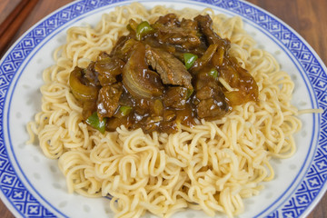 beef with onions and Chinese noodles