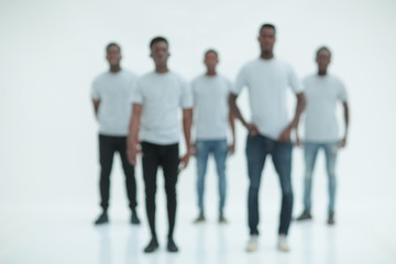 Fototapeta na wymiar blurry image of a group of young men in white t-shirts