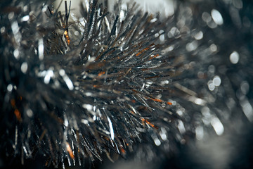 Silver tinsel. Christmas decoration. Close up. Whole background.