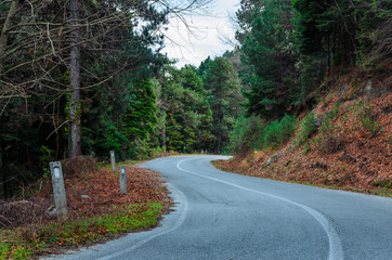 Curvy rural road leading through the amazing landscape of Olympus Mount.