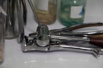 Sterile medical instruments are prepared for surgery in a veterinary clinic. Close-up, selective focus.