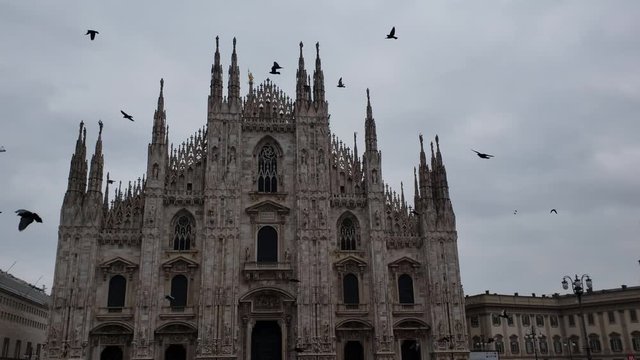 Milan, Italy - April, 2019 - Wide Shot of the front facade of the Milan Cathedral (Duomo di Milano).