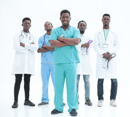 smiling surgeon standing in front of his colleagues