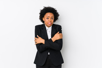 Middle aged african american business  woman against a white background isolated going cold due to low temperature or a sickness.