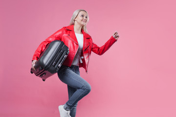 Concept, ready to trip. Young woman with travel suitcase late for the flight.