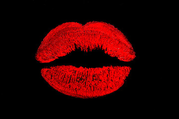 Red lips. Red Kiss. Print of red lipstick on a dark background. Lipstick traces of sexy female lips.