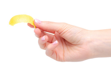 Lemon peel zest in hand on white background isolation
