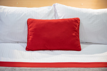 red pillow on the bed