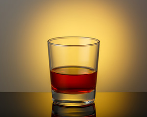 A glass of whiskey on a dark surface with a reflection. Space for text