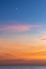 The Moon and Venus in the evening sky at sunset