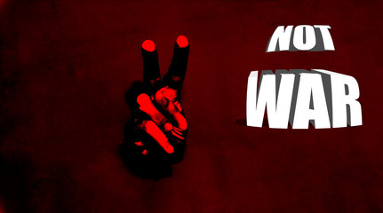 Male hand with the two finger. Body language concept with hole in red paper wall. Hand Peace Sign....