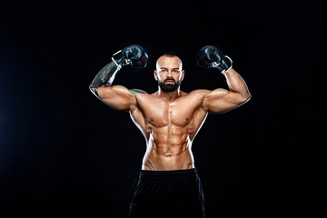 Fitness and boxing concept. Boxer, man fighting or posing in gloves on black background. Individual...