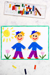 Photo of colorful drawing: Identical twins. Two smiling brothers look the same