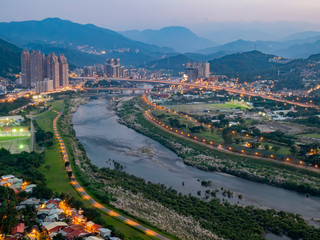 Fototapeta premium Night aerial shot of the New Taipei City cityscape