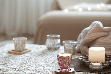 Still life with candles on the table in the living room.