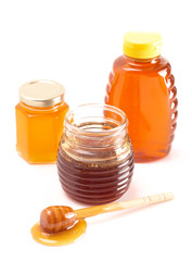 Jars of Raw Natural Honey on a White Background
