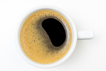 Coffee cup espresso on white kitchen table. Coffee cup closeup. Morning, breakfast, energy, coffee break concept. Top view