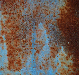 iron texture of rusty sheet with remains of blue paint. Metal rusty texture