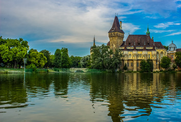 Fototapeta na wymiar old European castle palace medieval times architecture building in Budapest capital of Hungary in summer time near lake waters environment